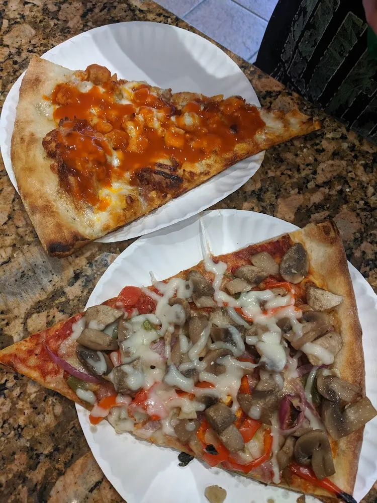 Spicy Buffalo Pizza and a Slice of Peppers Onions Mushrooms